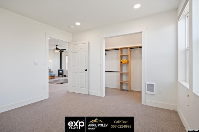 unfurnished bedroom featuring carpet floors, baseboards, visible vents, and recessed lighting