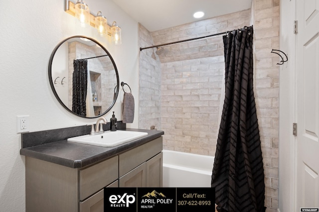 full bathroom featuring shower / tub combo and vanity