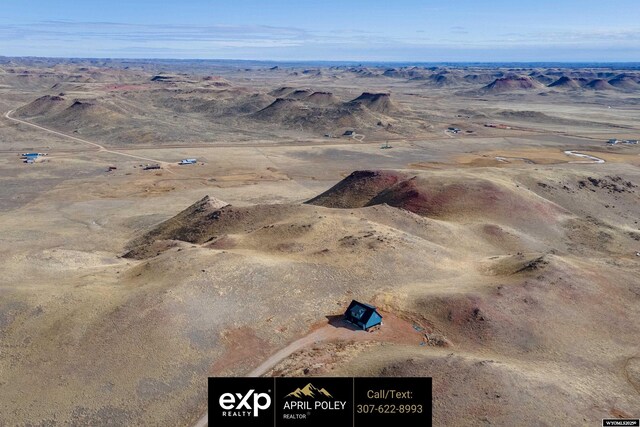 birds eye view of property featuring a desert view