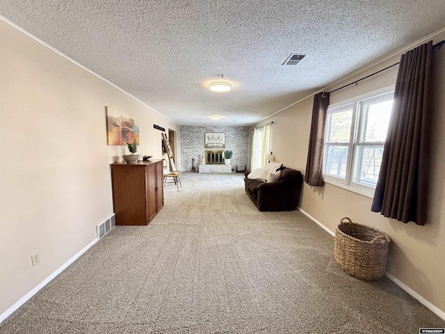 sitting room featuring visible vents, light carpet, baseboards, and a fireplace