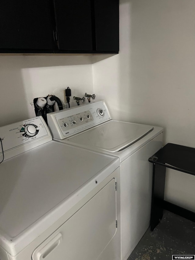 laundry room with cabinet space and independent washer and dryer