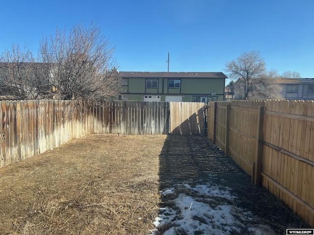 view of yard with a fenced backyard