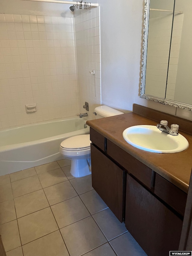 full bath featuring tile patterned floors, toilet, tub / shower combination, and vanity