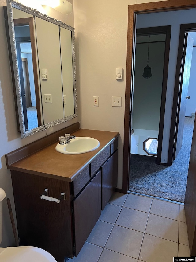 bathroom with tile patterned flooring and vanity