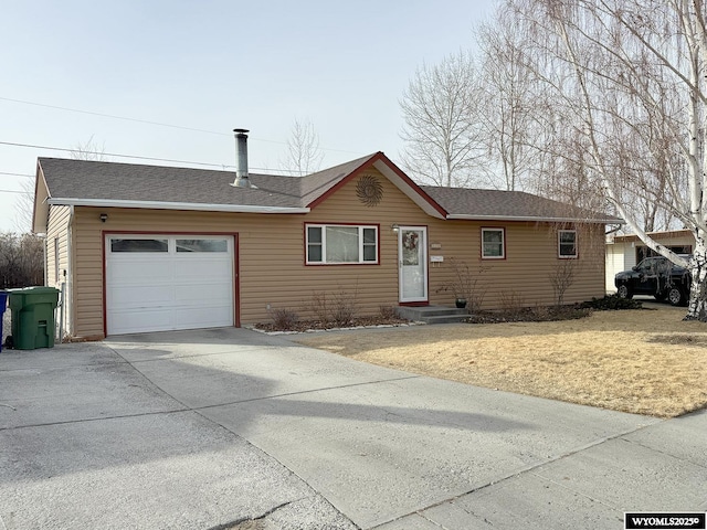 ranch-style home featuring an attached garage, driveway, and a shingled roof