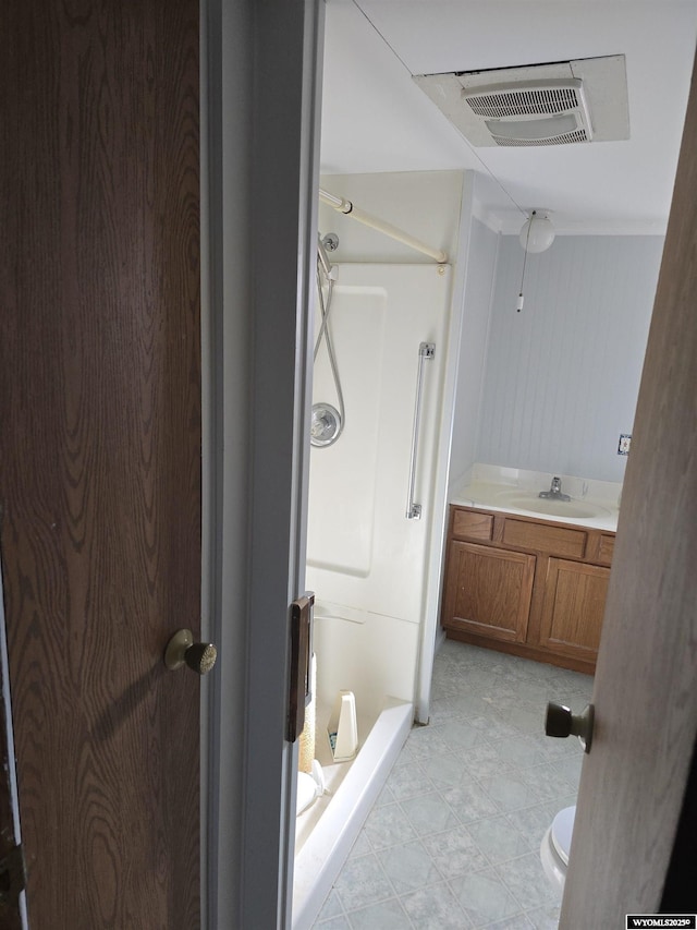 bathroom featuring visible vents, vanity, toilet, and a shower stall