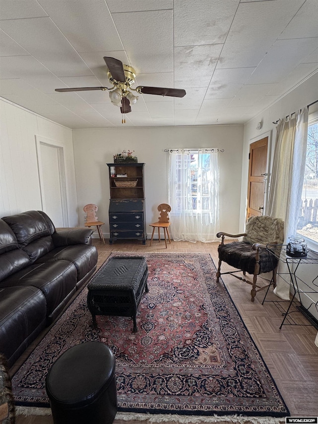 living room featuring a ceiling fan