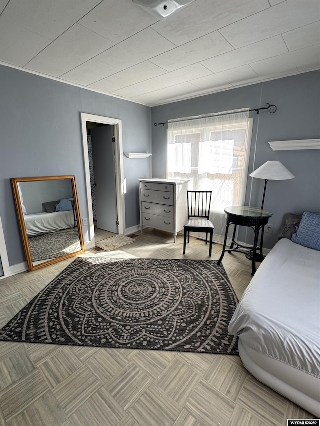 bedroom featuring baseboards