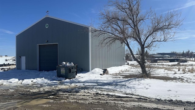 snow covered structure with an outdoor structure