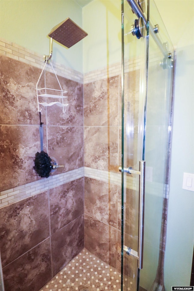 full bath featuring a shower stall