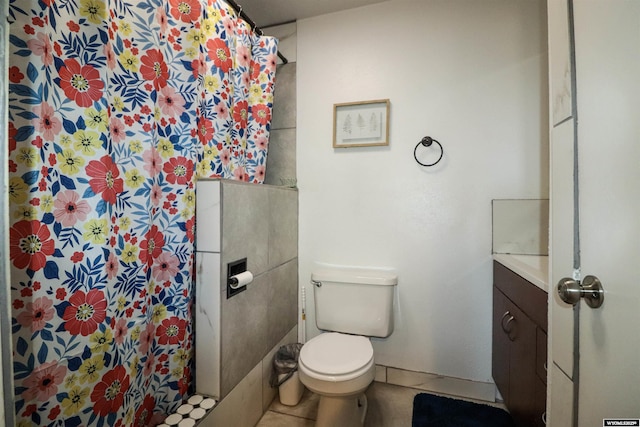 bathroom with curtained shower, tile patterned floors, toilet, and baseboards