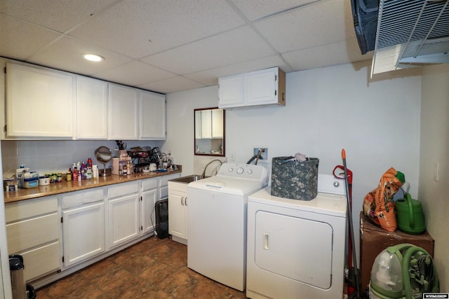 washroom with washer and dryer, cabinet space, and recessed lighting