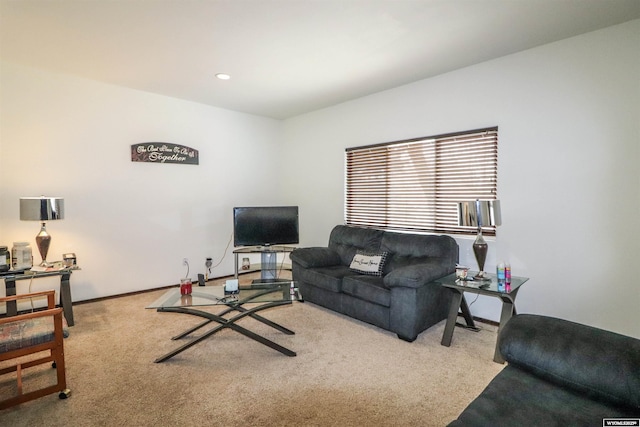 carpeted living area with recessed lighting