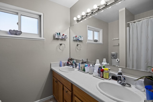 bathroom featuring double vanity and a sink