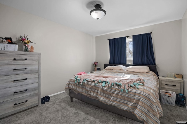 bedroom featuring carpet flooring and baseboards