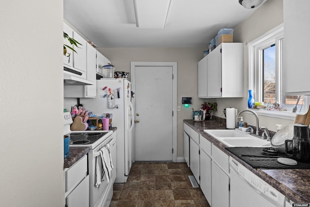kitchen with a sink, white appliances, dark countertops, and under cabinet range hood