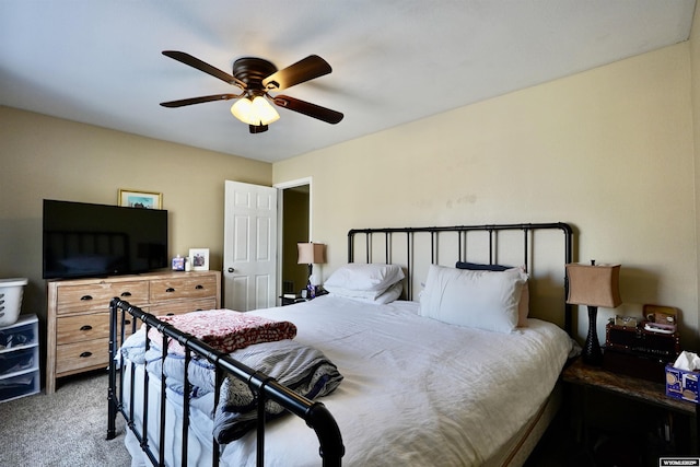 bedroom with ceiling fan and carpet floors