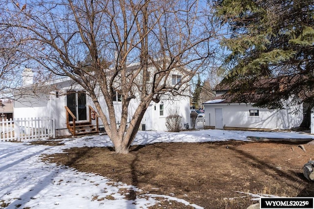 view of front of home featuring fence and entry steps