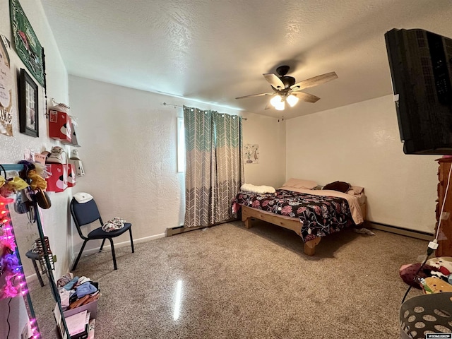 bedroom with a ceiling fan, baseboards, a textured ceiling, a textured wall, and baseboard heating