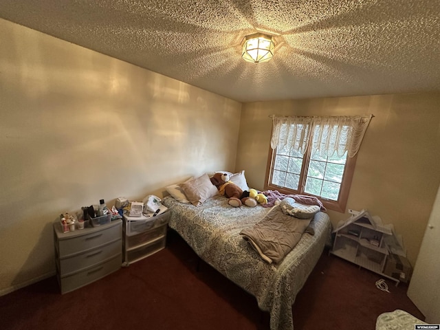 carpeted bedroom with a textured ceiling