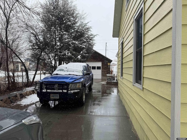 view of home's exterior with an outbuilding and a garage