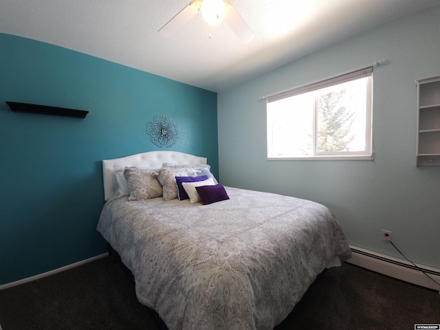 carpeted bedroom with a baseboard radiator, baseboards, and ceiling fan