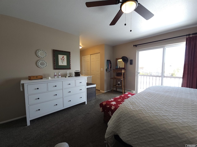 bedroom with access to exterior, baseboard heating, dark carpet, and baseboards