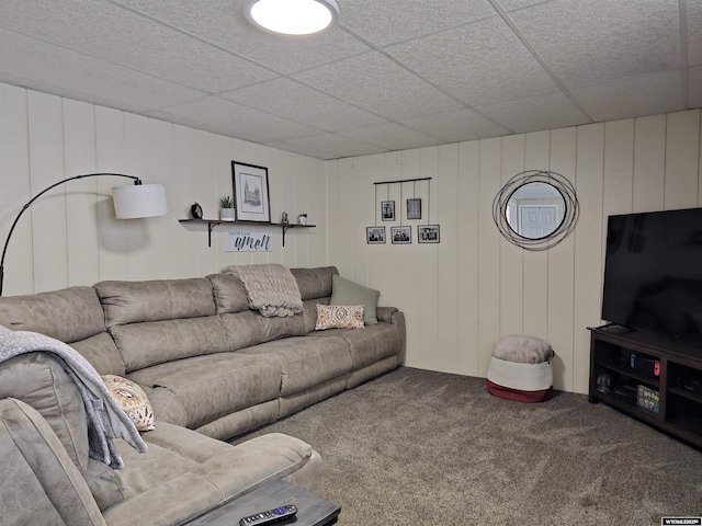 carpeted living room with a drop ceiling