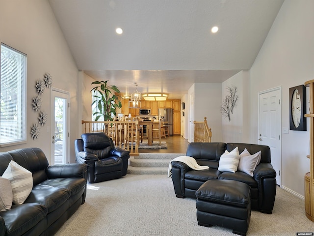 living area featuring recessed lighting, carpet floors, and high vaulted ceiling