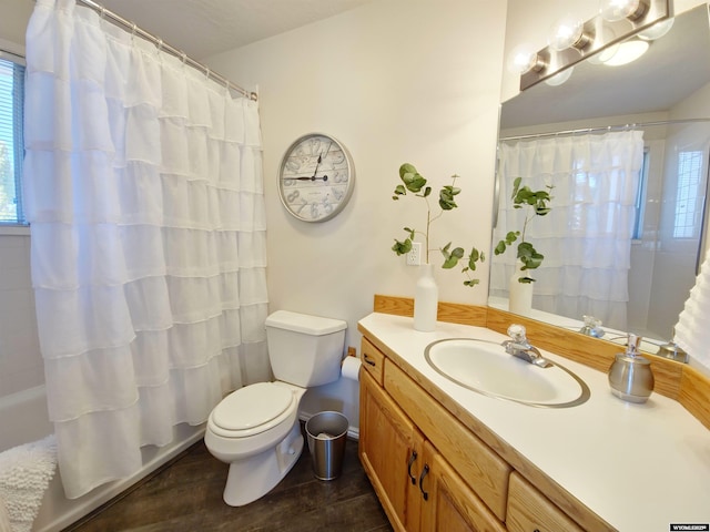 bathroom featuring vanity, toilet, and wood finished floors