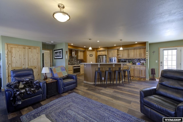 living area featuring recessed lighting and dark wood finished floors