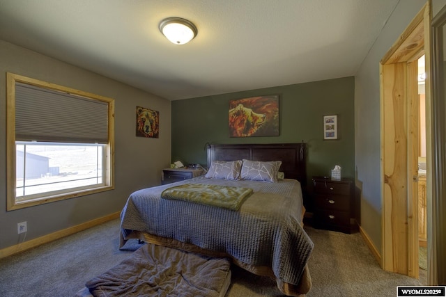 bedroom featuring baseboards and carpet floors