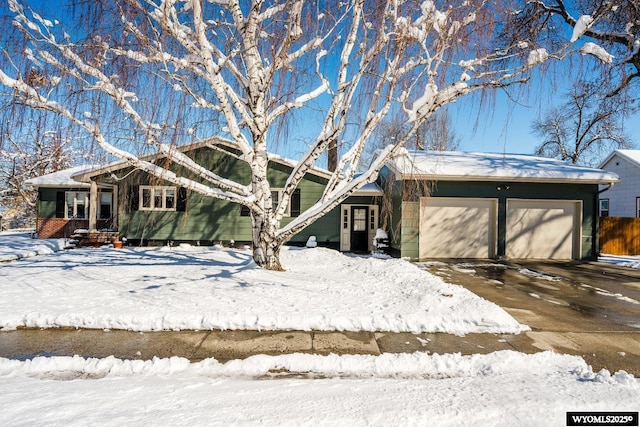 mid-century modern home with an attached garage and driveway