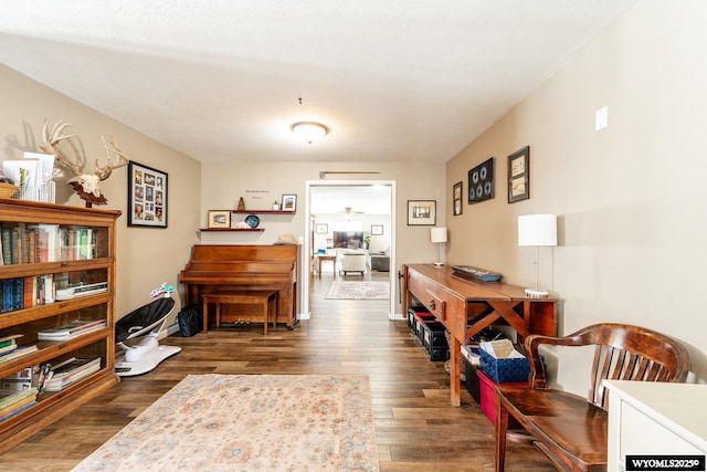 interior space with ceiling fan and wood finished floors