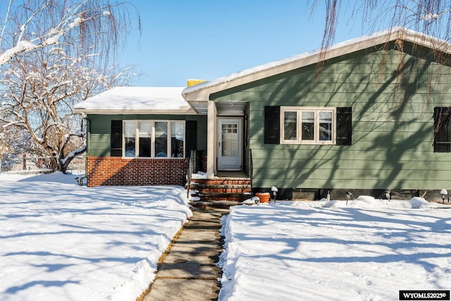 view of front of house with brick siding