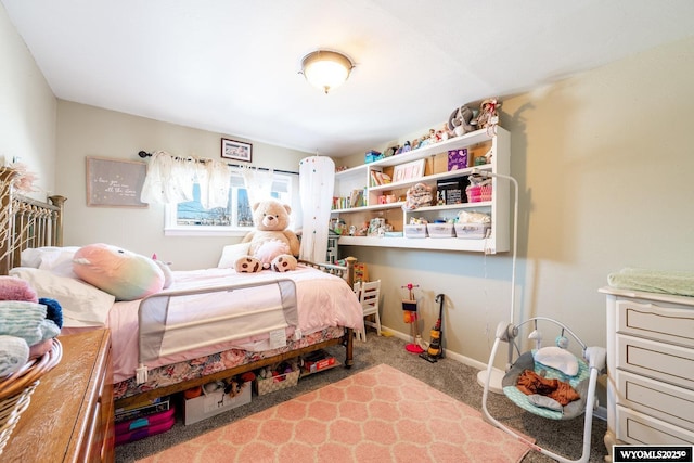 carpeted bedroom with baseboards