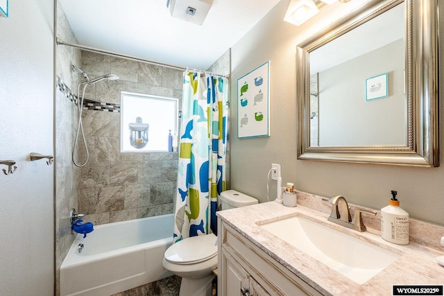 bathroom with vanity, shower / bath combination with curtain, and toilet