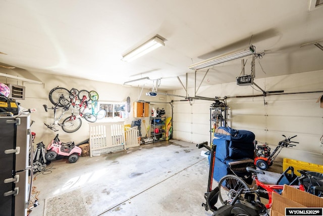 garage featuring a garage door opener and bike storage