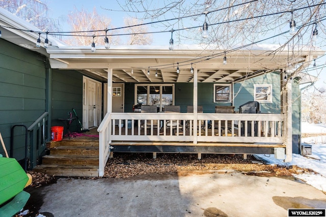 doorway to property featuring covered porch