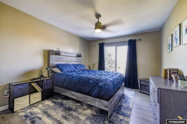 bedroom with a ceiling fan and wood finished floors