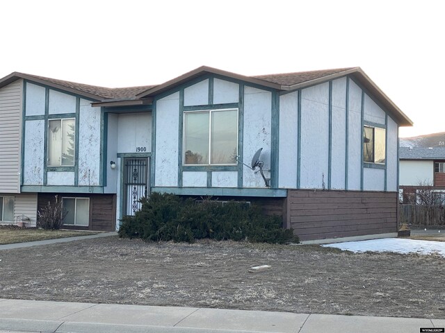 view of front of house featuring roof with shingles