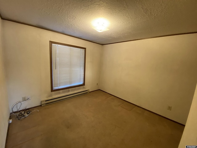 empty room featuring a baseboard heating unit, carpet floors, and a textured ceiling