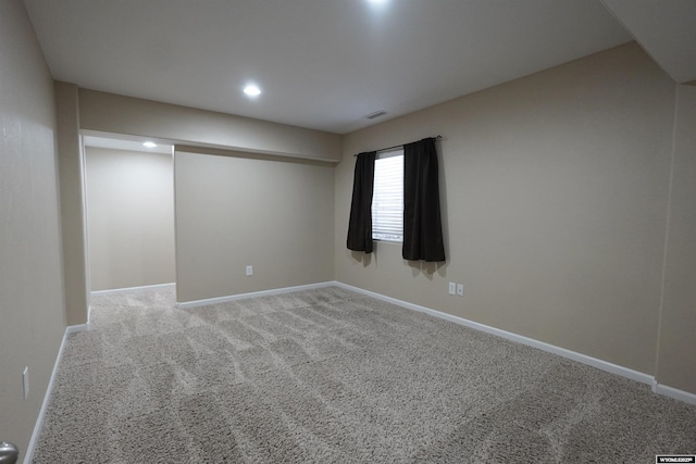 carpeted empty room with recessed lighting, visible vents, and baseboards