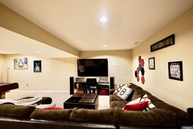 carpeted living area with recessed lighting and baseboards