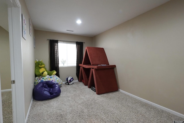 interior space featuring visible vents, carpet floors, and baseboards