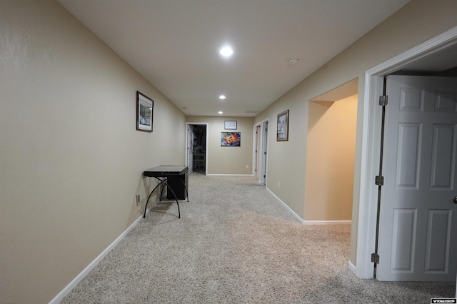 corridor featuring recessed lighting, baseboards, and carpet floors