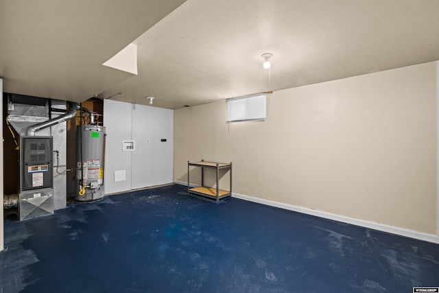 basement with water heater, heating unit, and baseboards