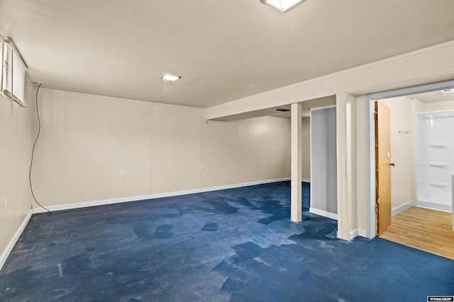 finished basement featuring baseboards