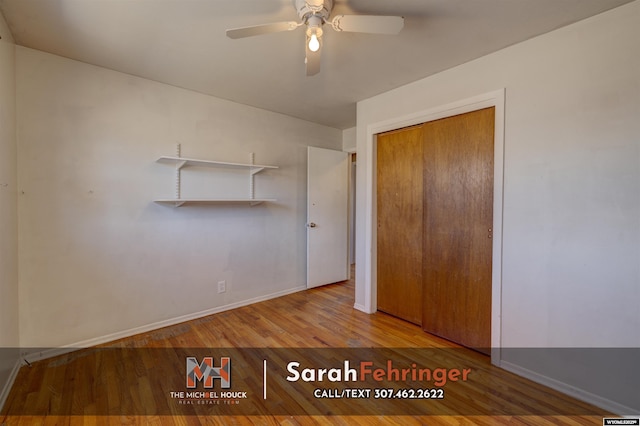 unfurnished bedroom with ceiling fan, a closet, baseboards, and wood finished floors