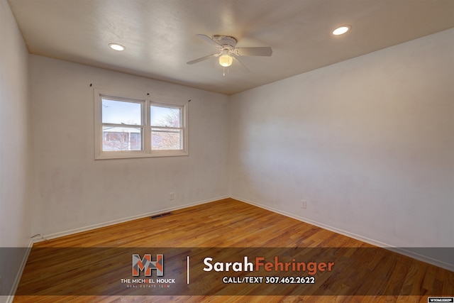 empty room with visible vents, a ceiling fan, wood finished floors, recessed lighting, and baseboards